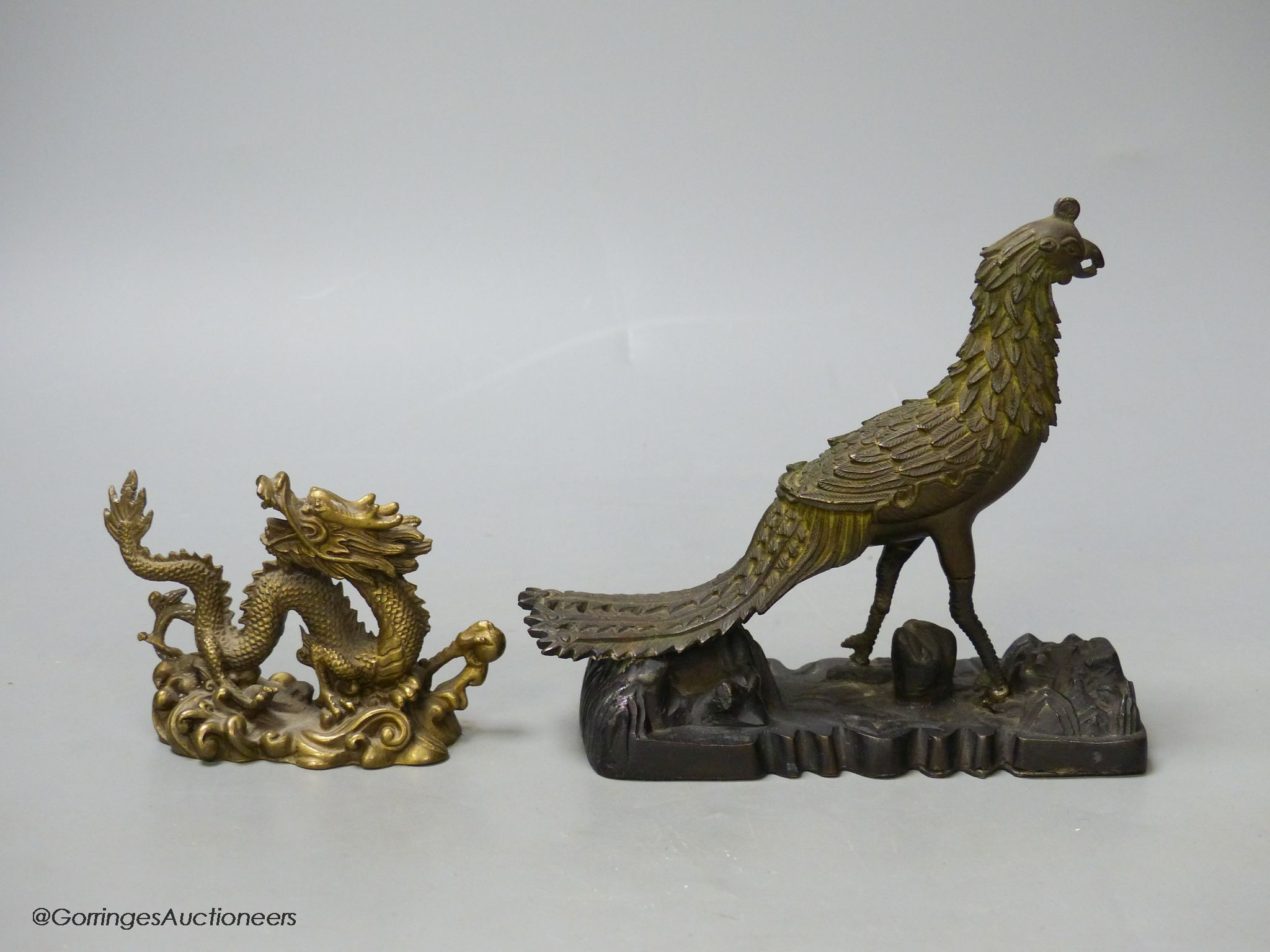 A 19th century Chinese bronze figure of a phoenix, repairs, and a 20th century Chinese bronze figure of a dragon, tallest 13.5cm